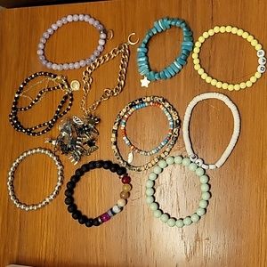 A dozen bracelets and butterfly hair clips for $10